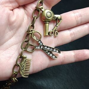 Bronze colored hairdresser charm bracelet